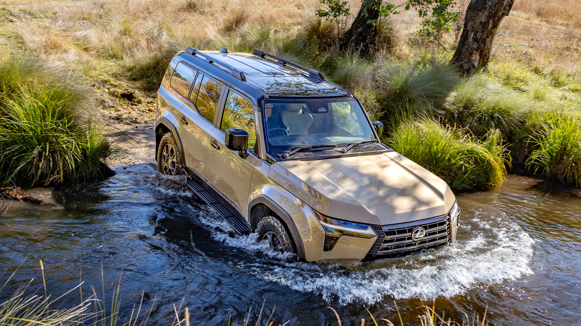 The Lexus GX in Earth tone enters a freshwater crossing