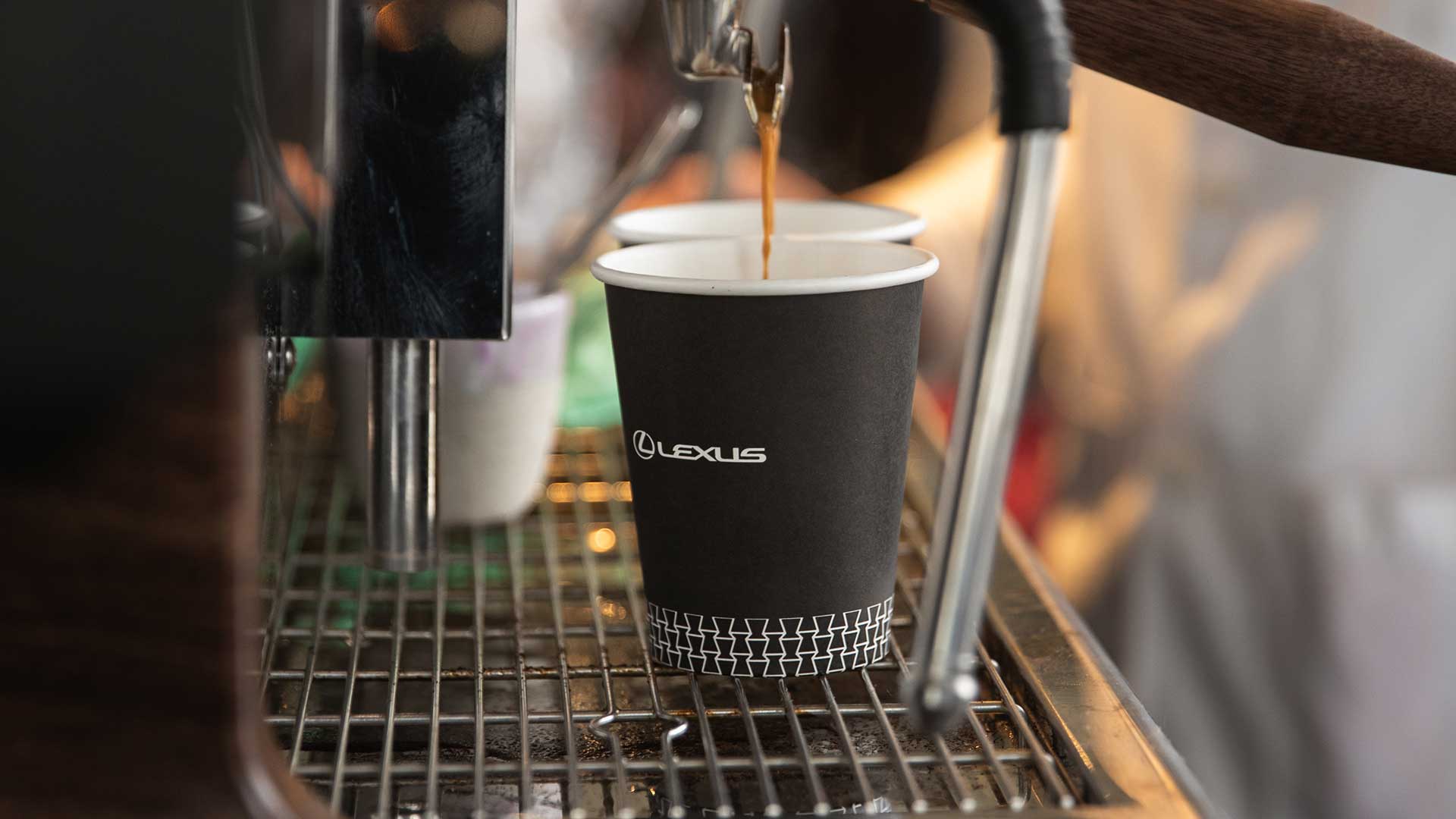 A coffee cup with the Lexus branding