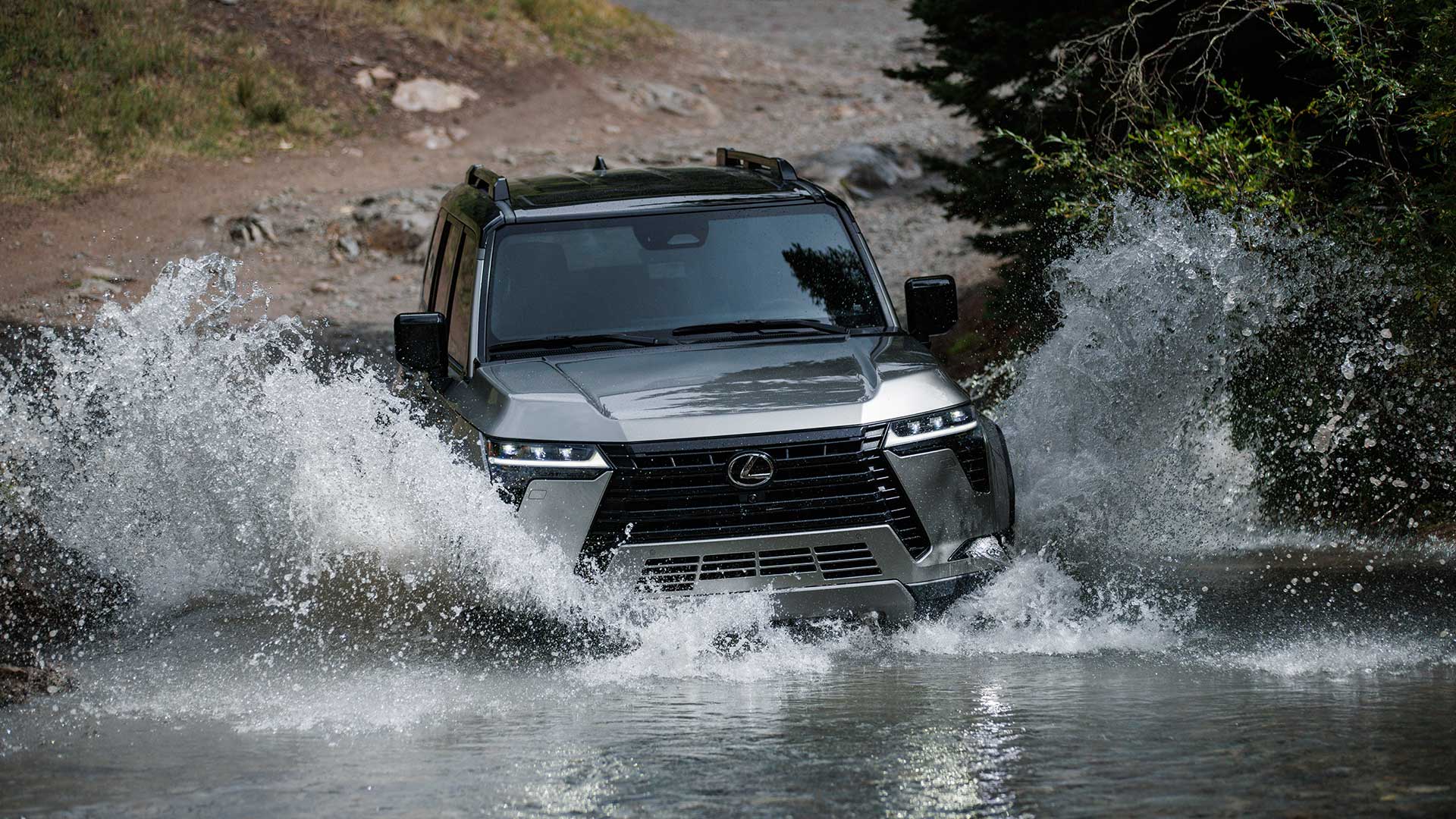 A grey Lexus GX driving through a freshwater crossing