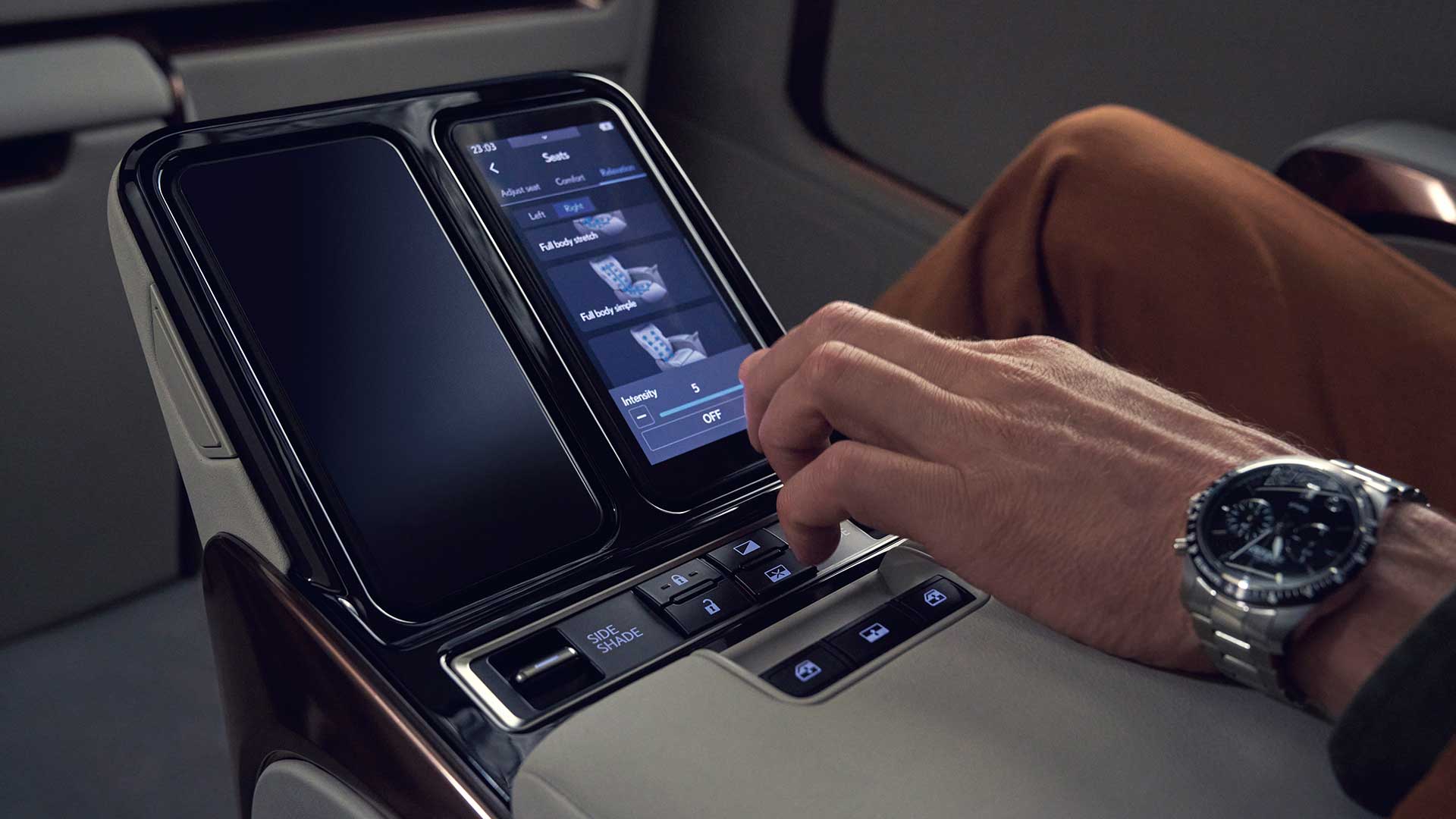 The back seat centre console of the Lexus LM 500h Ultra Luxury vehicle