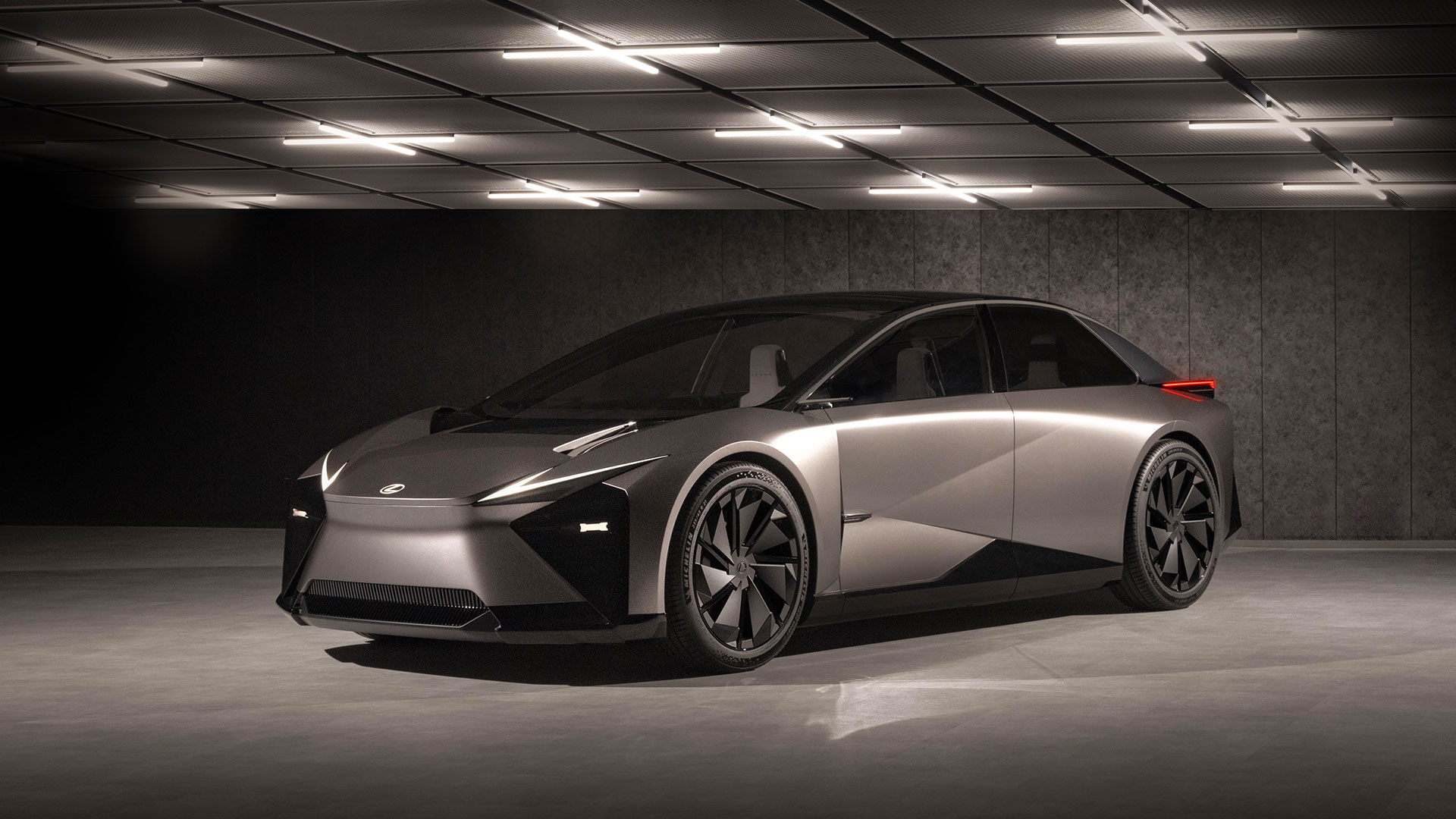 The Lexus LF-ZC vehicle parked underneath lights
